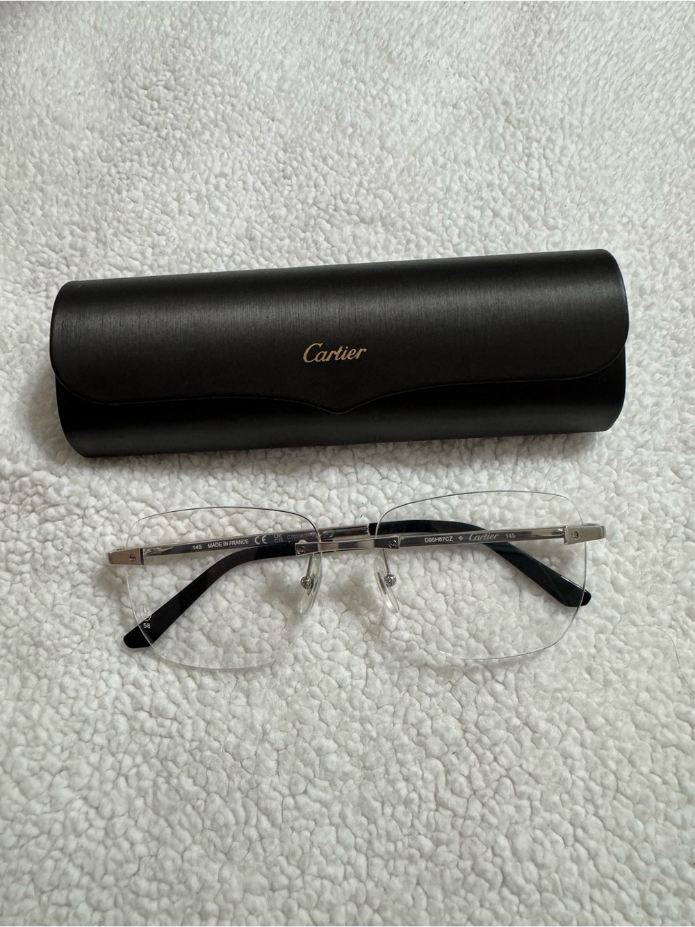 Cartier Rimless Glasses with Silver Frame and Black Temples